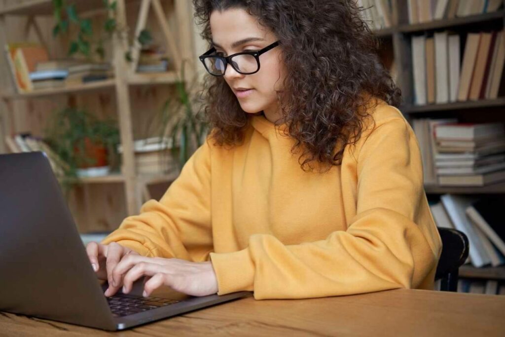 In this image, we see a beautiful woman working on her Apple laptop, fully immersed in her work. Her flawless skin and radiant smile are a testament to her confidence, intelligence, and grace. The laptop itself is a symbol of innovation, creativity, and productivity, and this woman embodies those qualities effortlessly. As a seller of used Apple laptops with warranty, we understand the importance of finding the right tool to help you achieve your goals, just as this woman has found the perfect laptop to help her excel in her work. Whether you're a student, a professional, or simply someone who appreciates the value of a high-quality device, we believe that our used Apple laptops are the perfect choice for anyone looking to unlock their full potential.