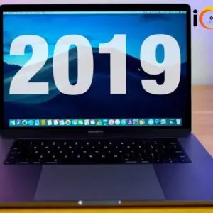 Side view of a 2019 MacBook Pro A1990 laptop showcasing its sleek design, space gray finish, and vibrant Retina display.